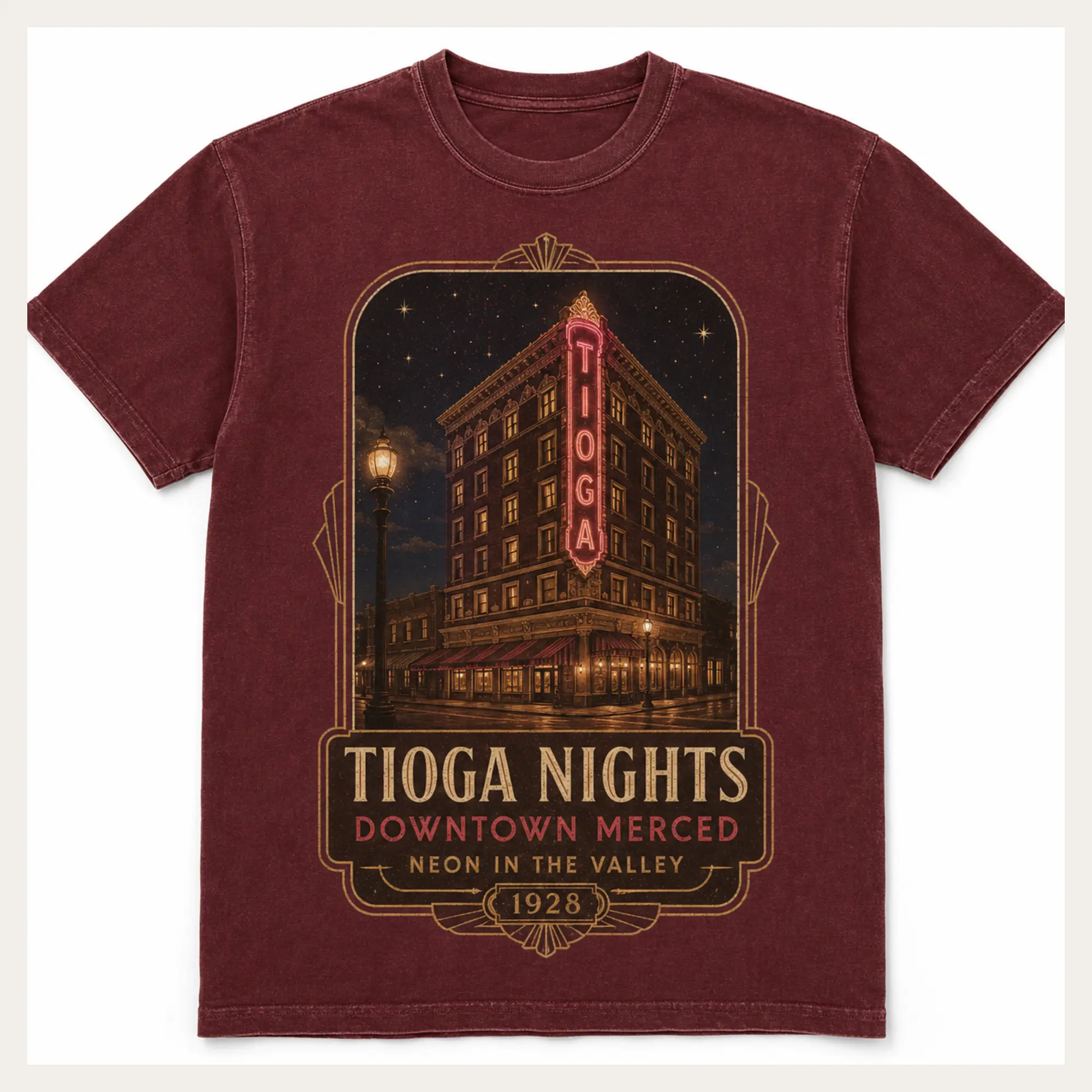Washed burgundy Tioga Nights graphic T-shirt with a vintage downtown Merced building and neon sign