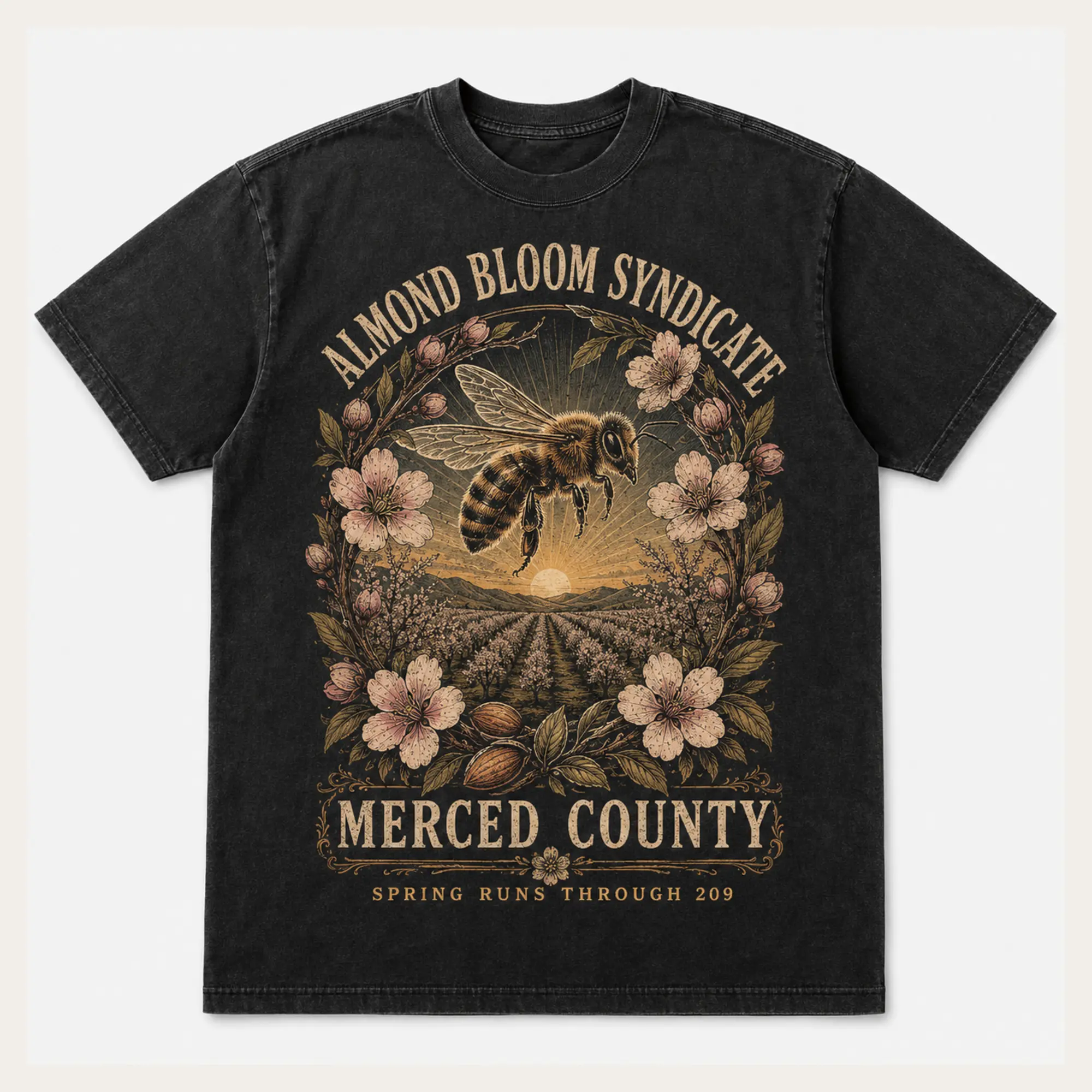 Washed black Almond Bloom Syndicate Merced County graphic T-shirt with almond blossoms and orchard rows