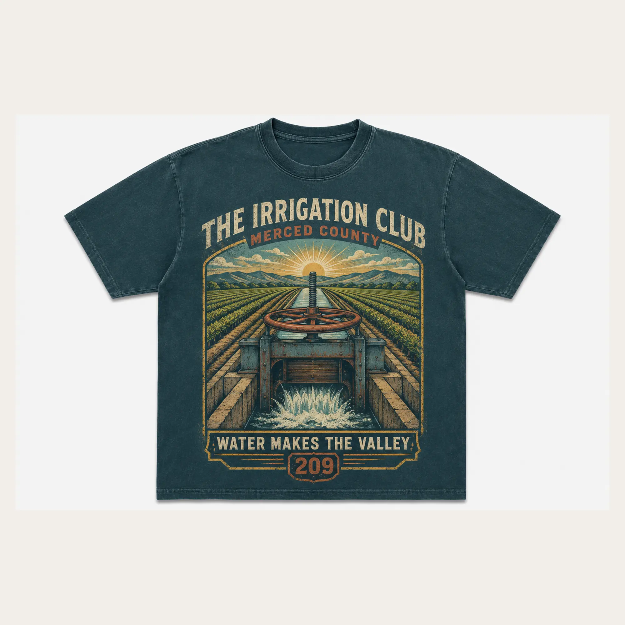 Dark teal Irrigation Club Merced County graphic T-shirt with a vintage canal and field illustration