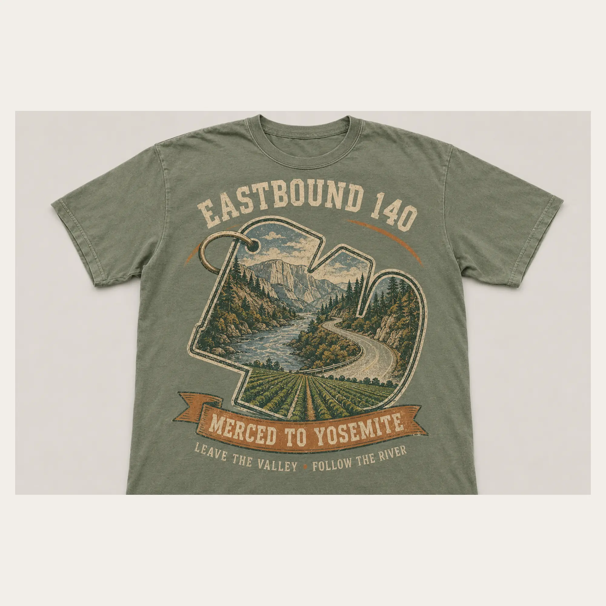 Sage green Eastbound 140 graphic T-shirt with a vintage winding road from Merced toward Yosemite