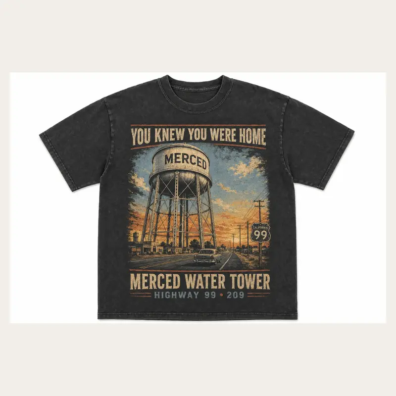 Washed charcoal Merced Water Tower graphic T-shirt with a vintage tower and valley sunset illustration