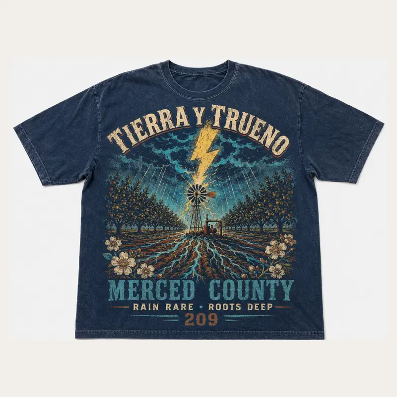 Washed indigo Tierra y Trueno Merced County graphic T-shirt with lightning over orchard rows